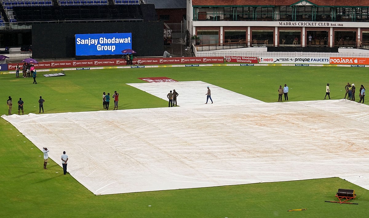  Photo: PTI/R Senthilkumar : Ground staff cover the pitch as rain stops play during the second women's T20I between India and South Africa in Chennai on Sunday (July 7, 2024).